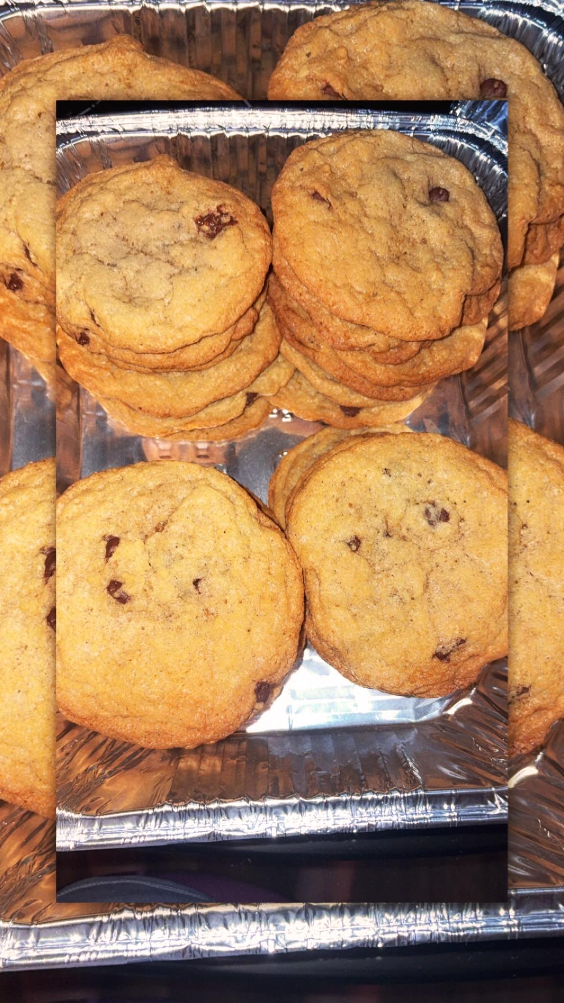 Chocolate chip cookies stacked on a tray
